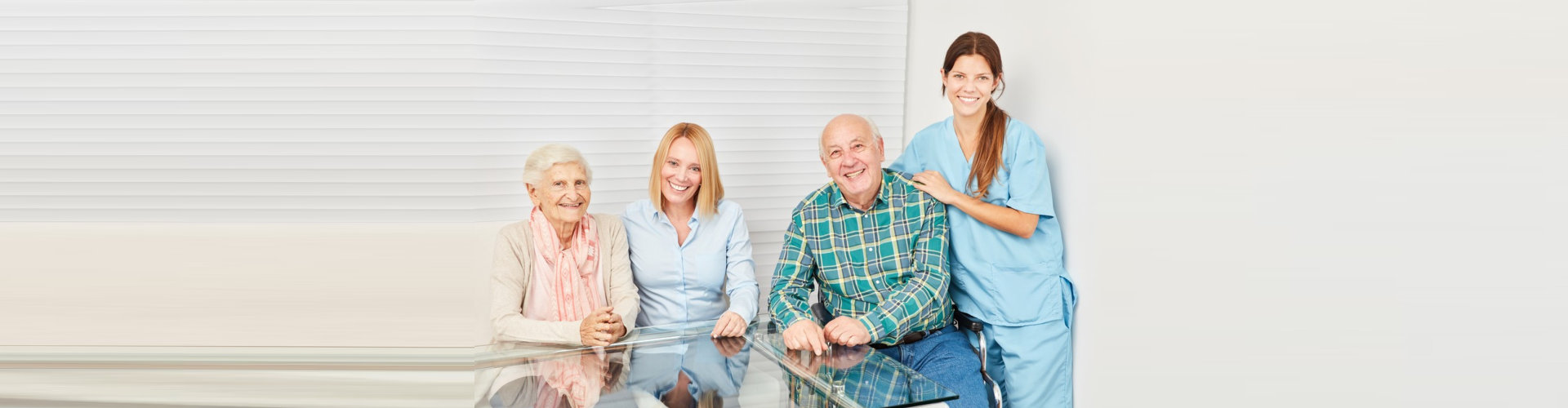 two seniors and two female caregivers